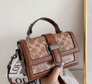 COACH STUDDED SLING BAG ( BROWN )